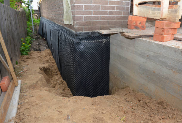 Happy homeowners after waterproofing job in Glenwood Landing